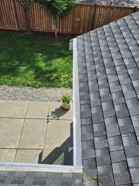 Professional gutter guard installation on residential home